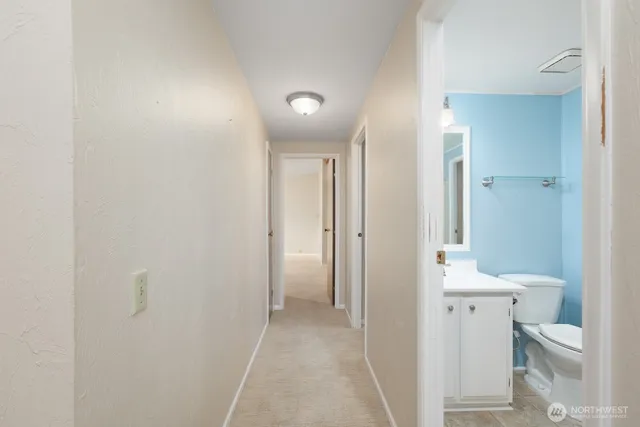 a view of bathroom with a sink and a toilet