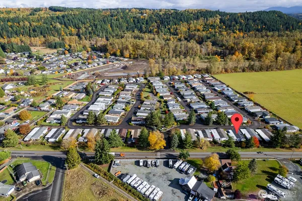 a view of backyard with porch and outdoor seating