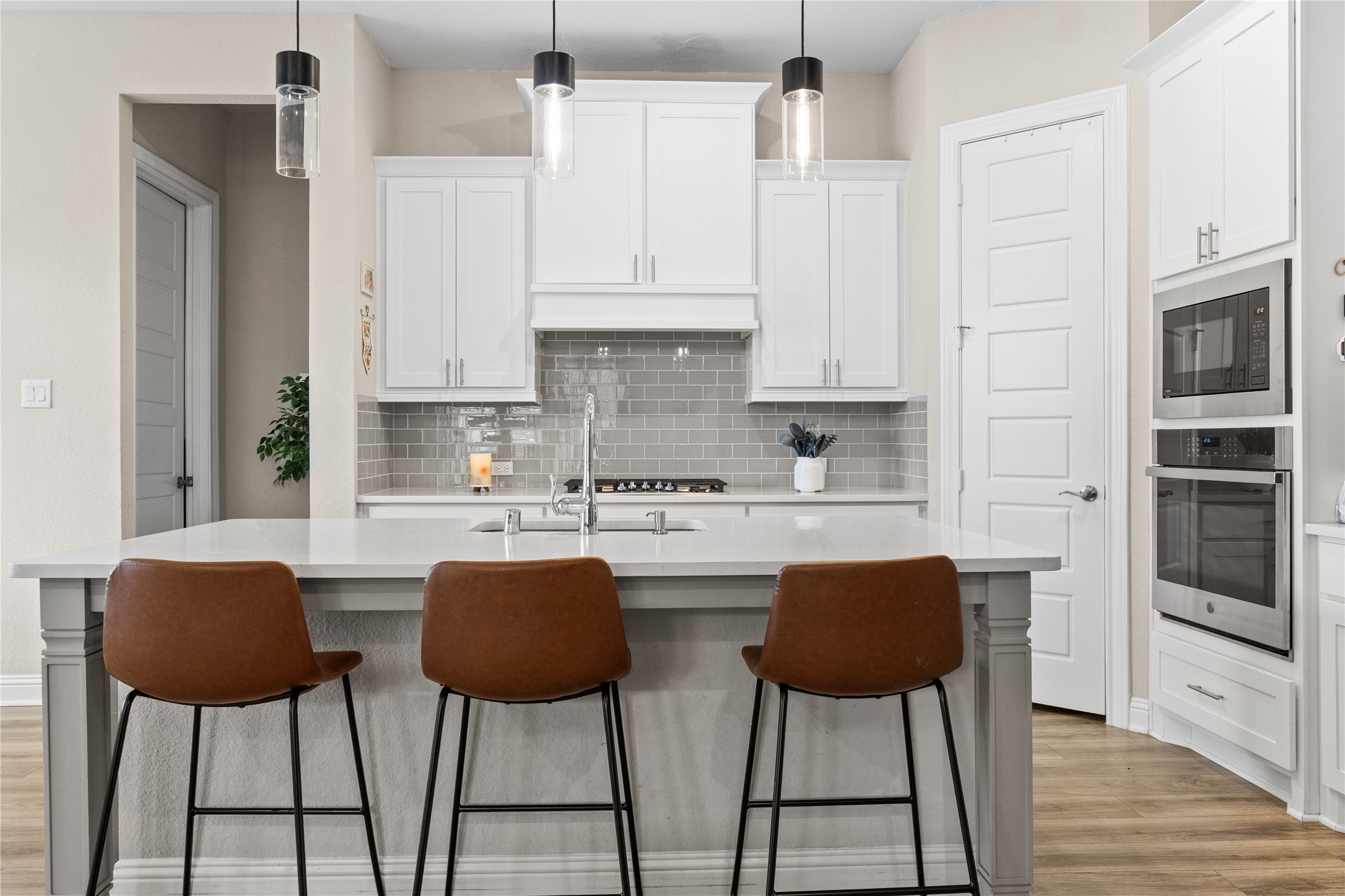 7518 Windsong Bend Road Spring, TX 77379 - Photo 14 of 49 a kitchen with stainless steel appliances kitchen island a table chairs and a refrigerator