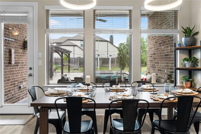 a view of a dining room with furniture water view and front of floor