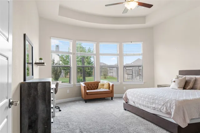 a livingroom with a couch and a window