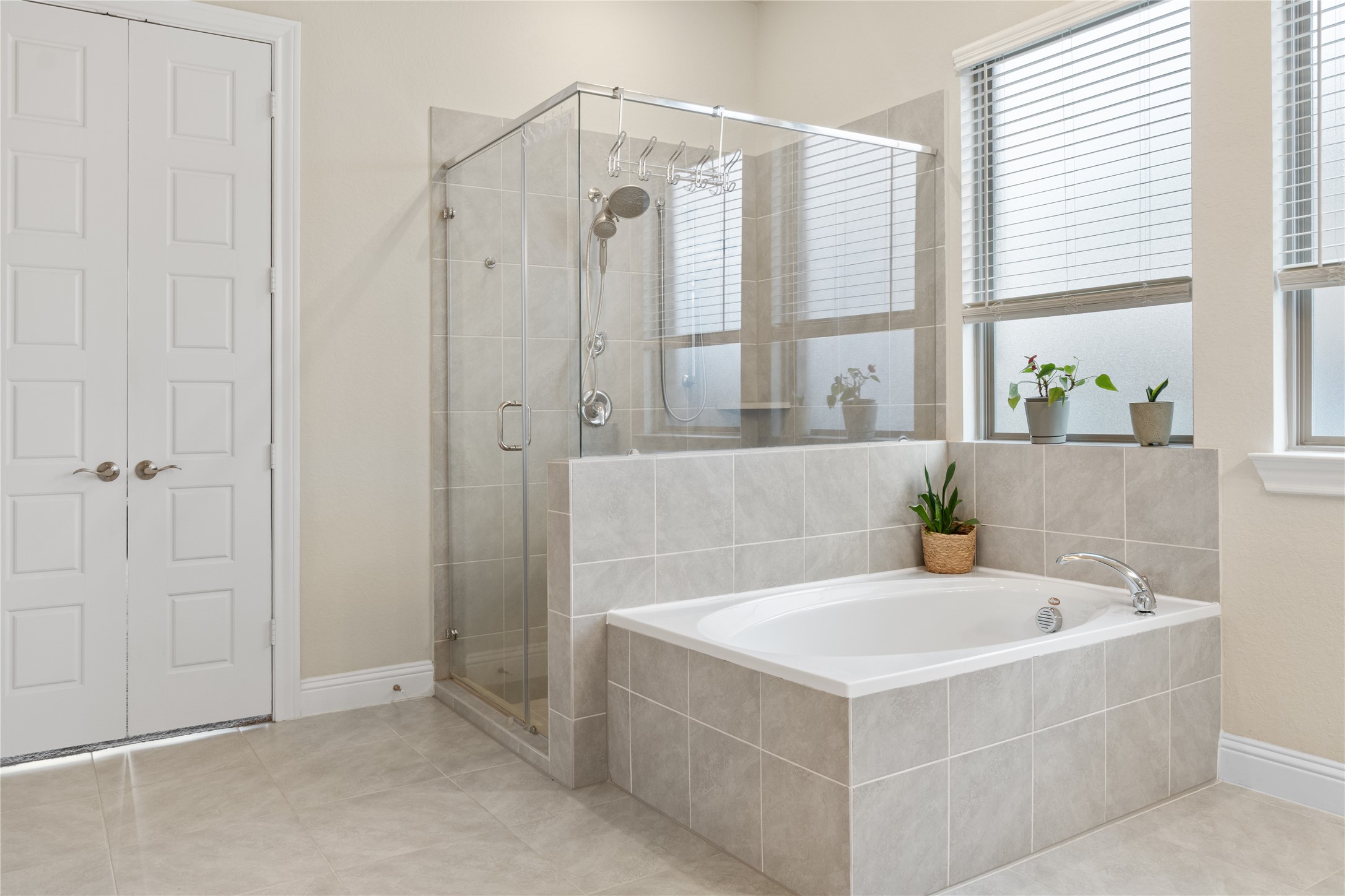 7518 Windsong Bend Road Spring, TX 77379 - Photo 28 of 49 a white bath tub sitting next to a shower