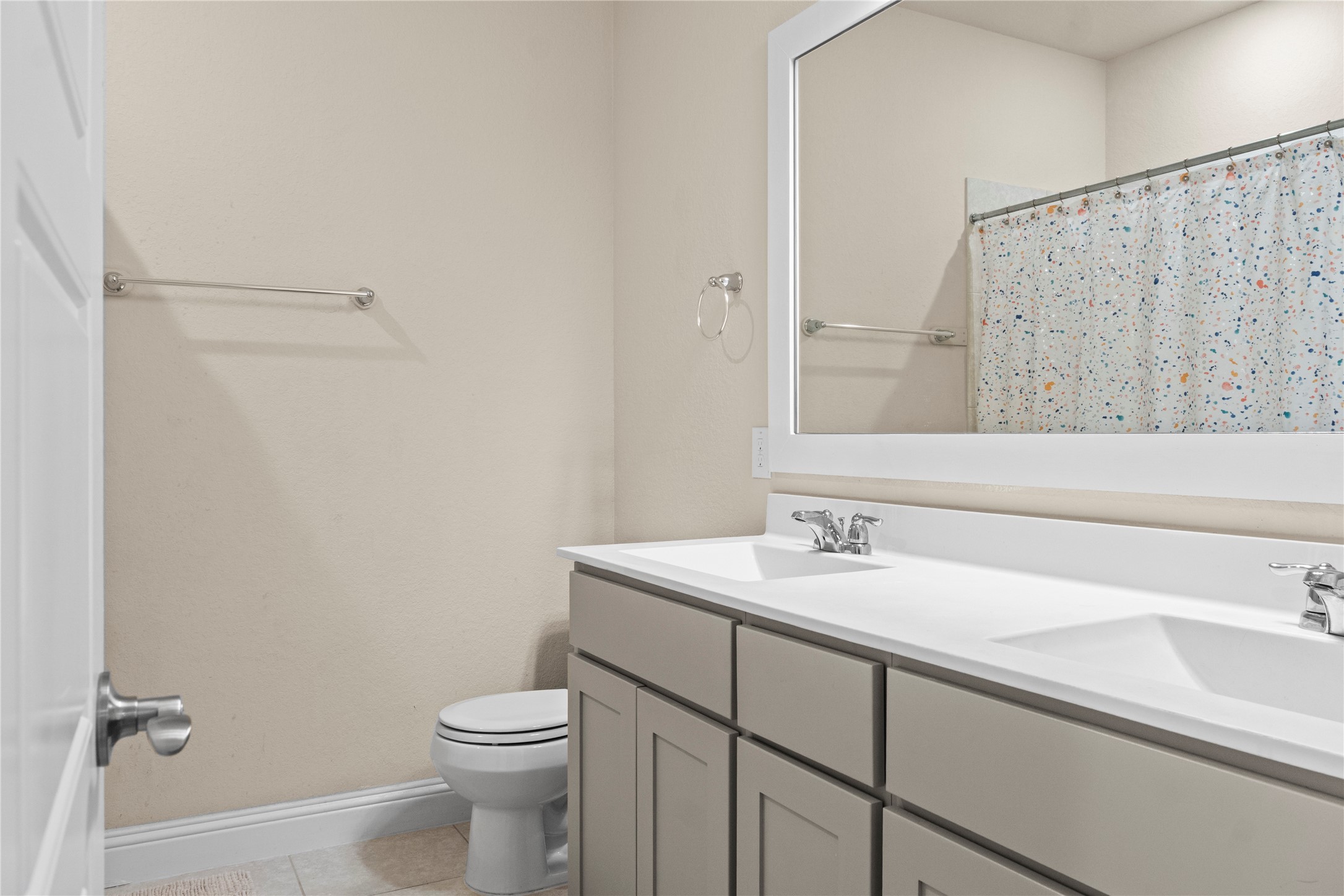 7518 Windsong Bend Road Spring, TX 77379 - Photo 30 of 49 a bathroom with a sink a toilet and a mirror