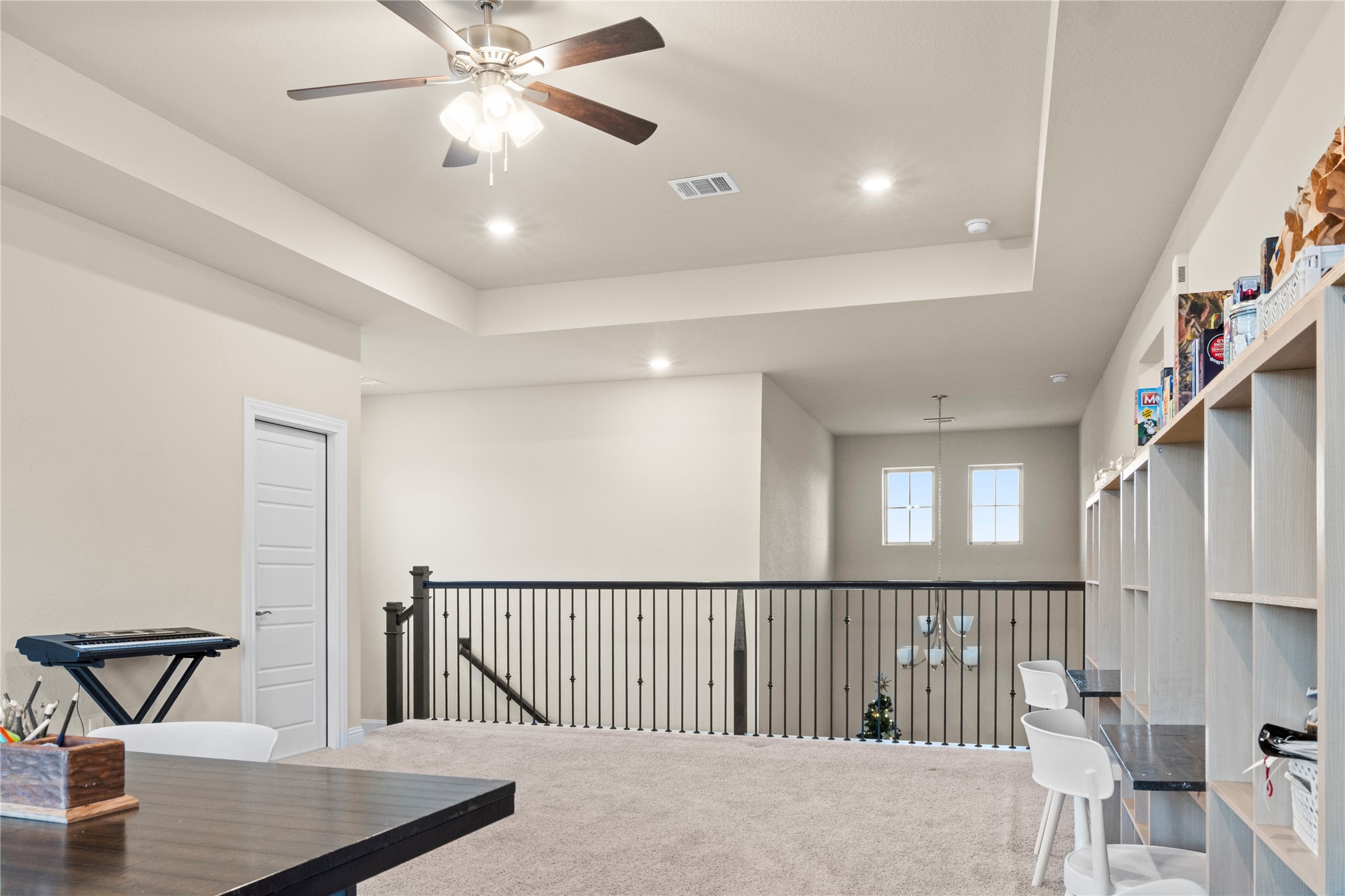7518 Windsong Bend Road Spring, TX 77379 - Photo 36 of 49 a view of staircase with a ceiling fan and window