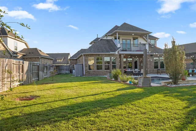 a view of a swimming pool with outdoor seating