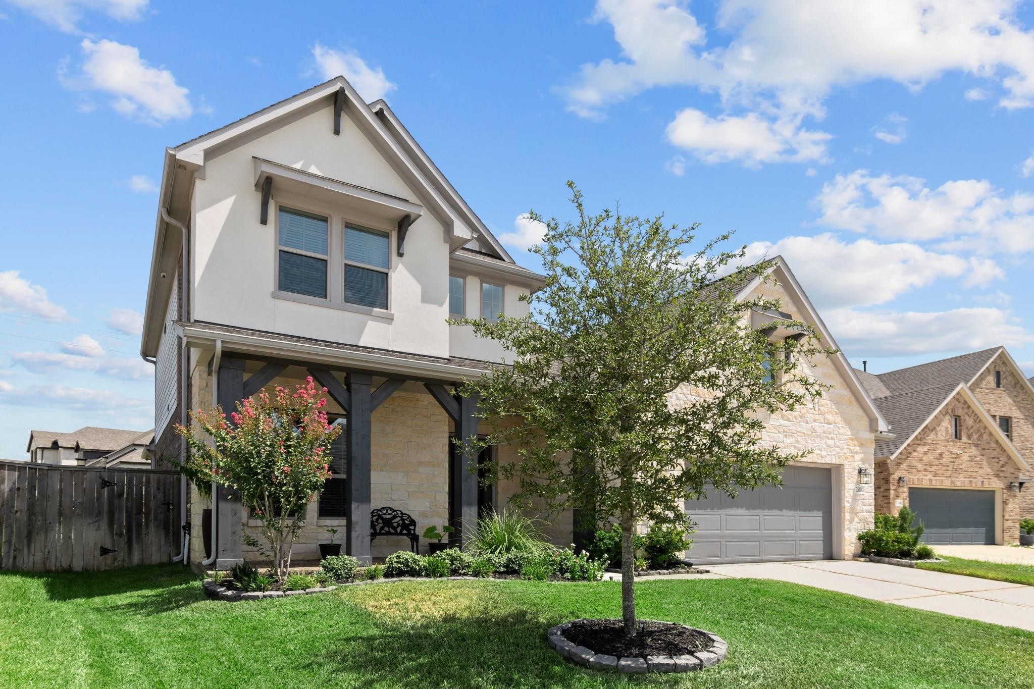 7518 Windsong Bend Road Spring, TX 77379 - Photo 4 of 49 a front view of a house with a yard
