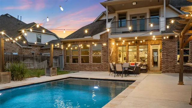 a view of swimming pool with a patio
