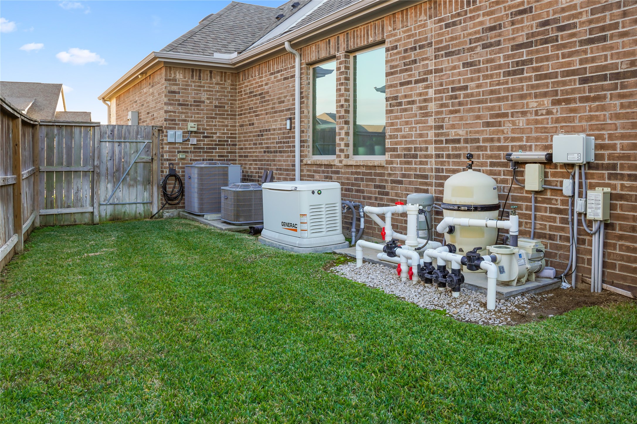7518 Windsong Bend Road Spring, TX 77379 - Photo 48 of 49 a view of a chair and table in backyard of the house