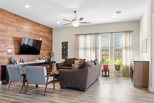 a living room with furniture and a large window