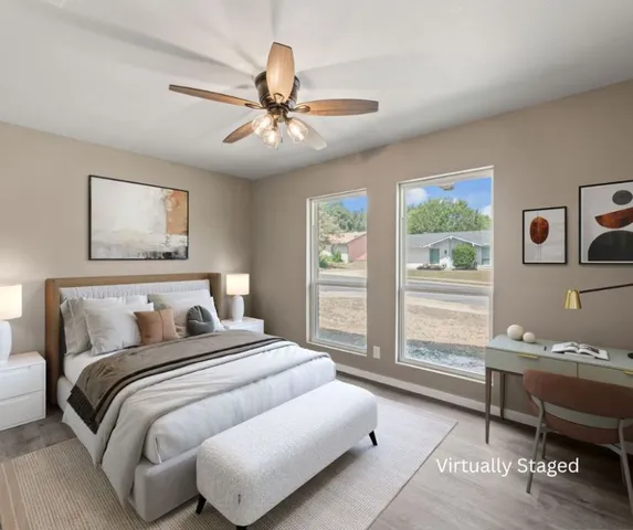 a bedroom with a large bed and a window