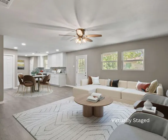 a living room with furniture and a large window