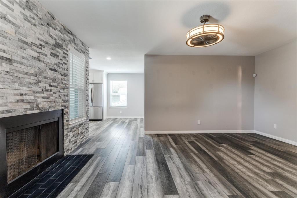 606 Ridgeline Drive Hurst, TX 76053 - Photo 6 of 29 a view of empty room with wooden floor and fireplace
