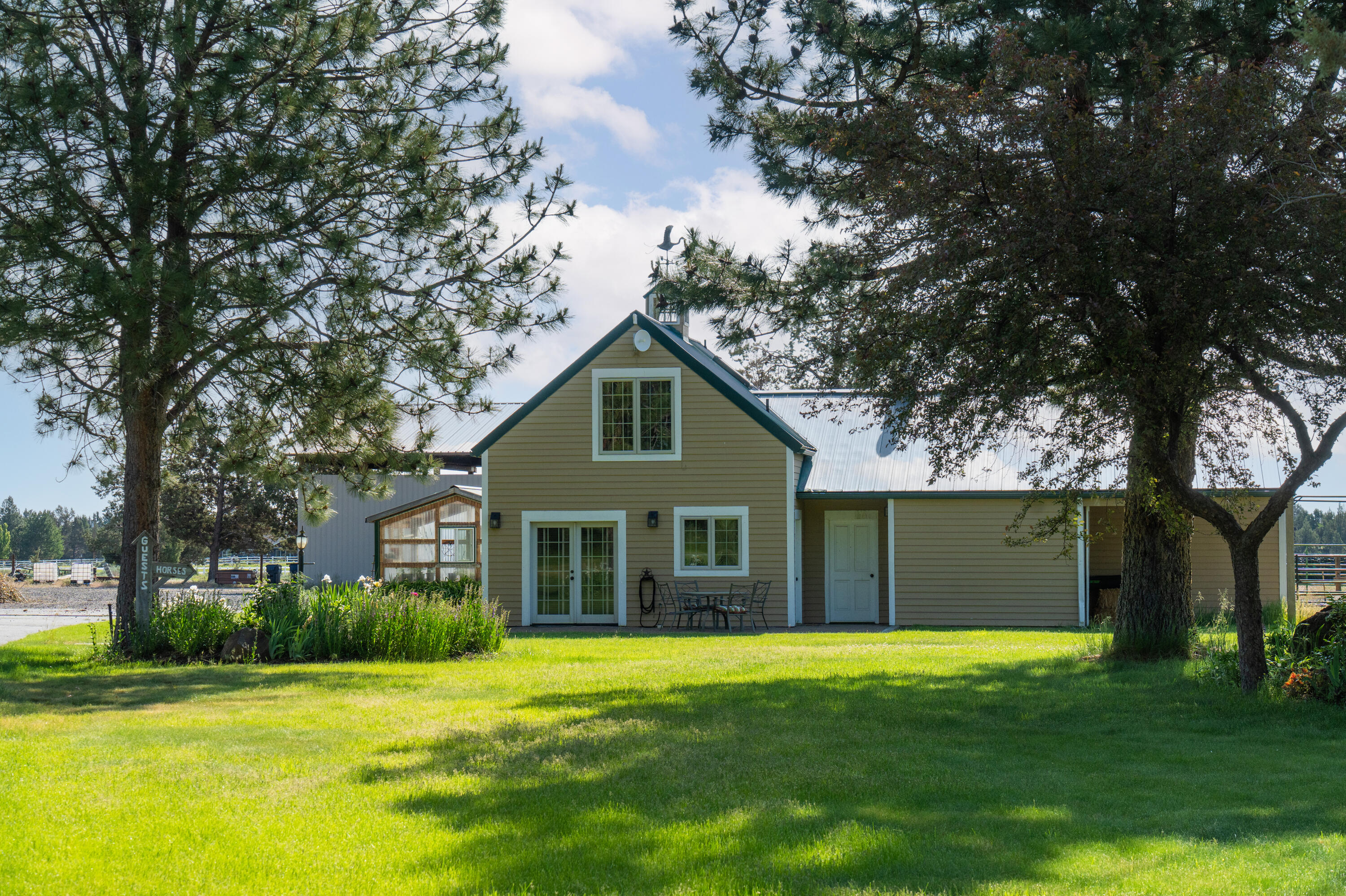 64950 Collins Road Bend, OR 97703 - Photo 75 of 87 a house view with a garden space