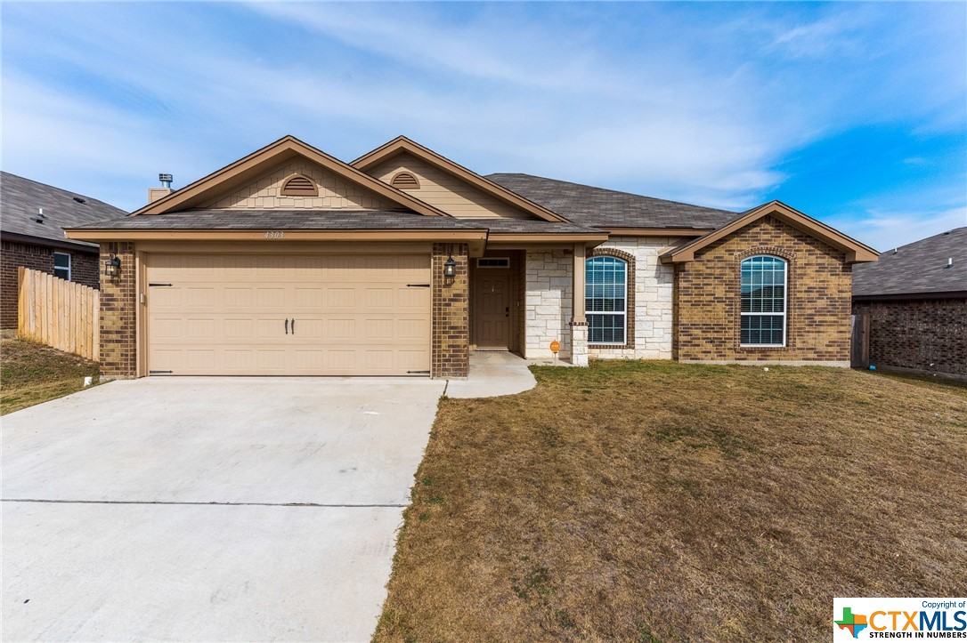 a front view of a house with yard
