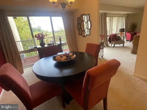 a living room with furniture and a mirror