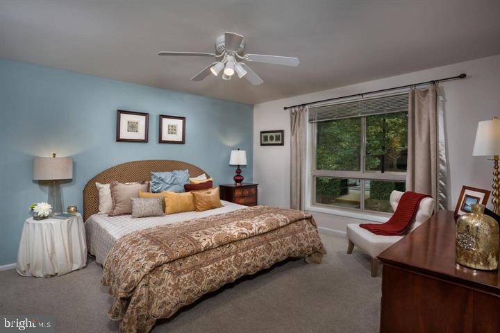 6 Knoll Ridge Court, Unit 1432 Baltimore, MD 21210 - Photo 3 of 20 a bedroom with a bed and window
