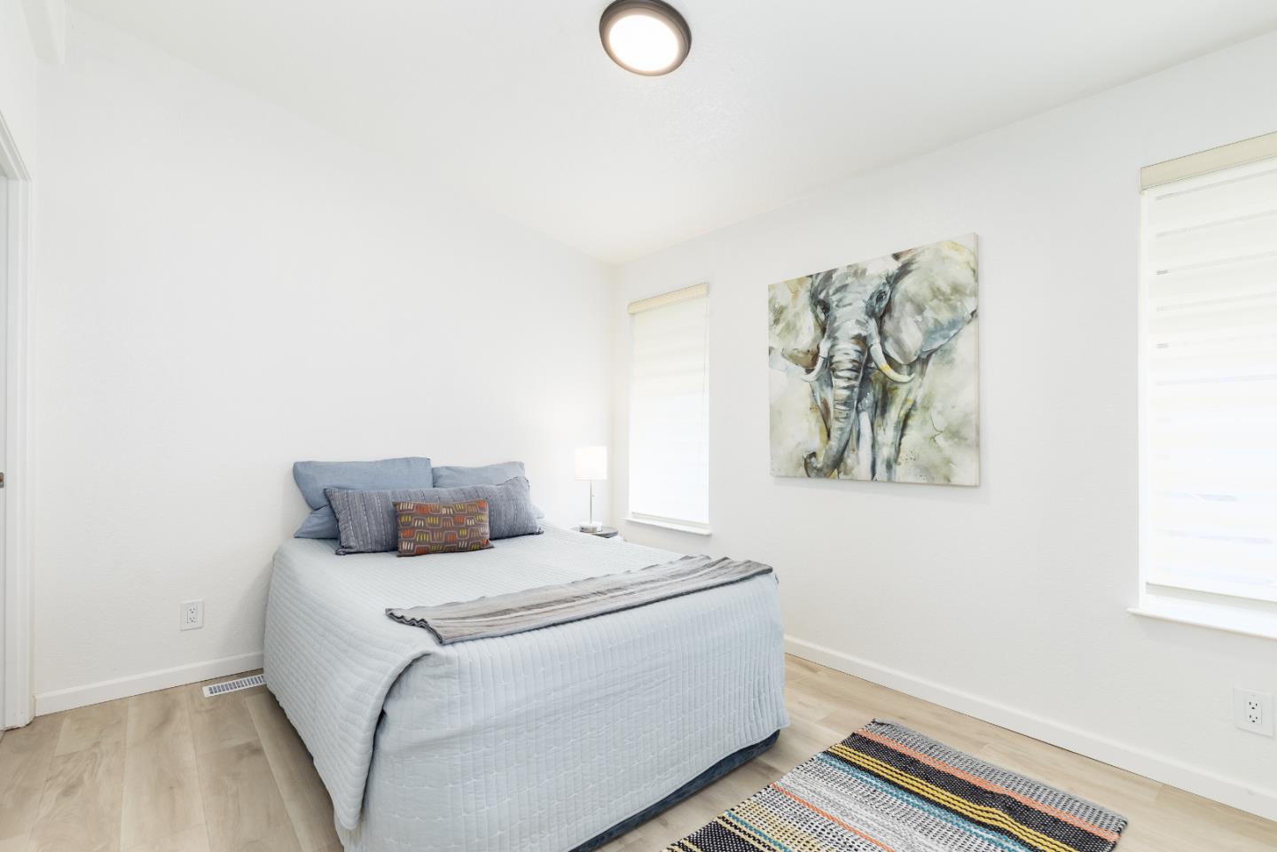 2546 Capitola Road, Unit 6 Santa Cruz, CA 95062 - Photo 15 of 40 a bedroom with a bed and a window