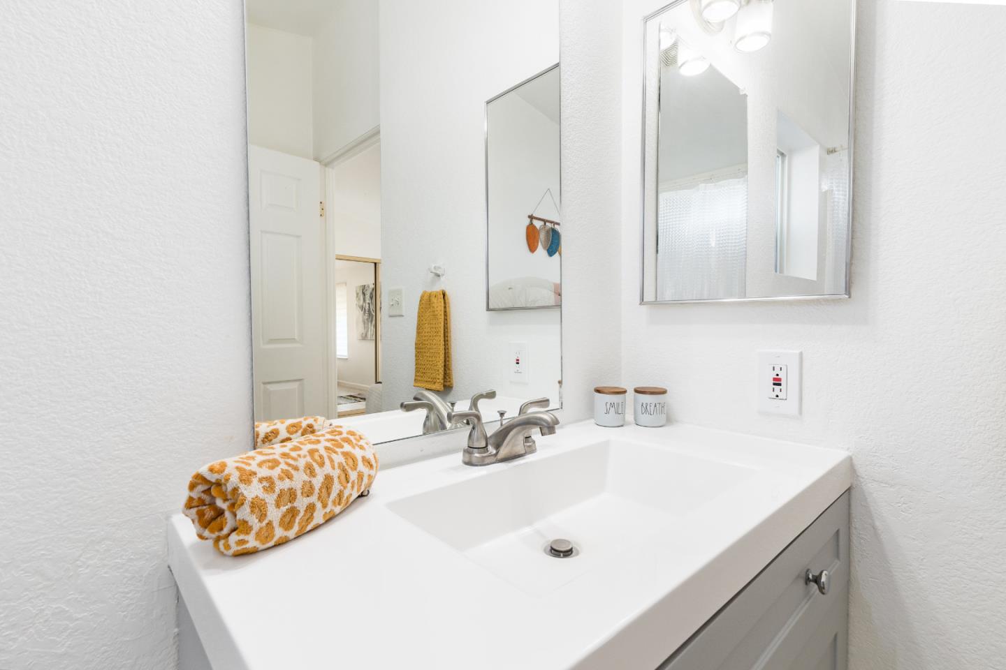 2546 Capitola Road, Unit 6 Santa Cruz, CA 95062 - Photo 19 of 40 a bathroom with a sink and a mirror