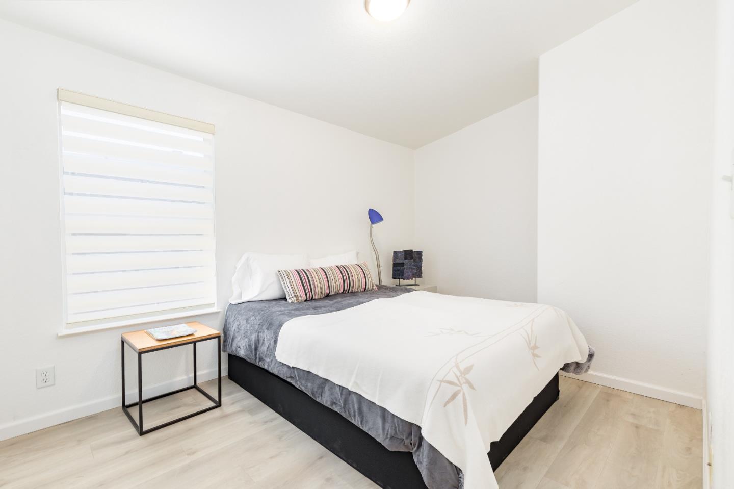 2546 Capitola Road, Unit 6 Santa Cruz, CA 95062 - Photo 20 of 40 a bedroom with a bed and window