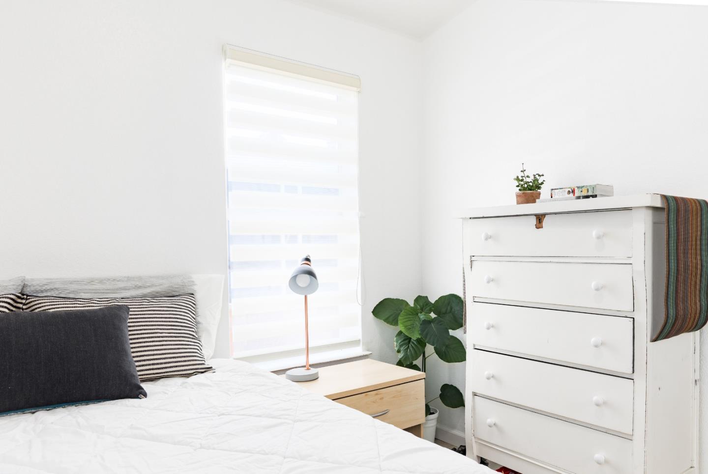 2546 Capitola Road, Unit 6 Santa Cruz, CA 95062 - Photo 22 of 40 a view of a bedroom with a bed and cabinet
