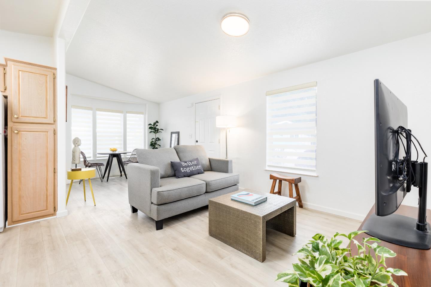 2546 Capitola Road, Unit 6 Santa Cruz, CA 95062 - Photo 4 of 40 a living room with furniture and a large window