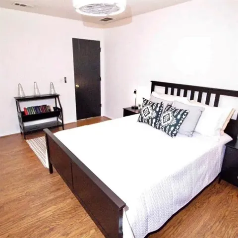 a living room with furniture and a rug