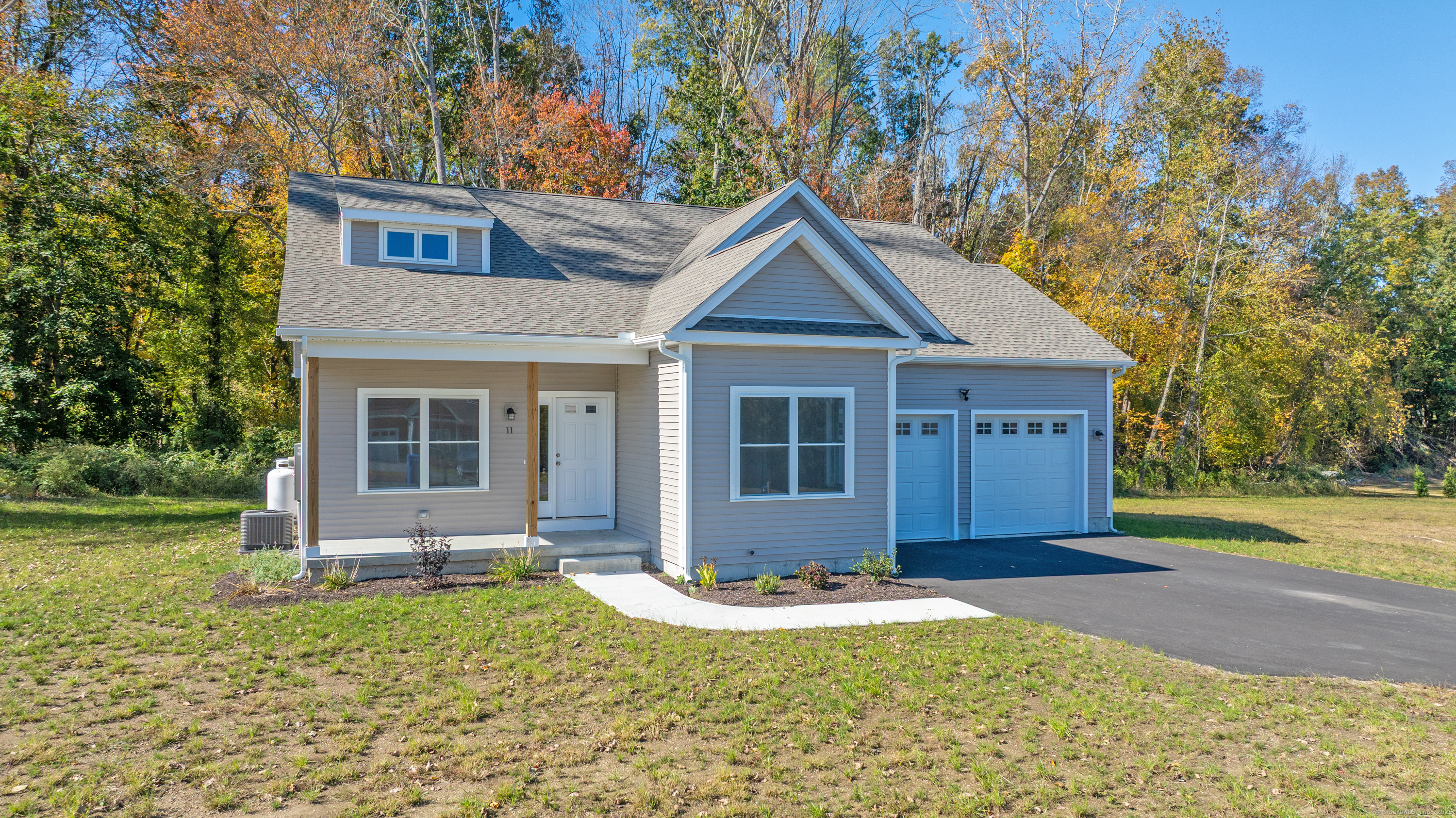 a front view of a house with garden
