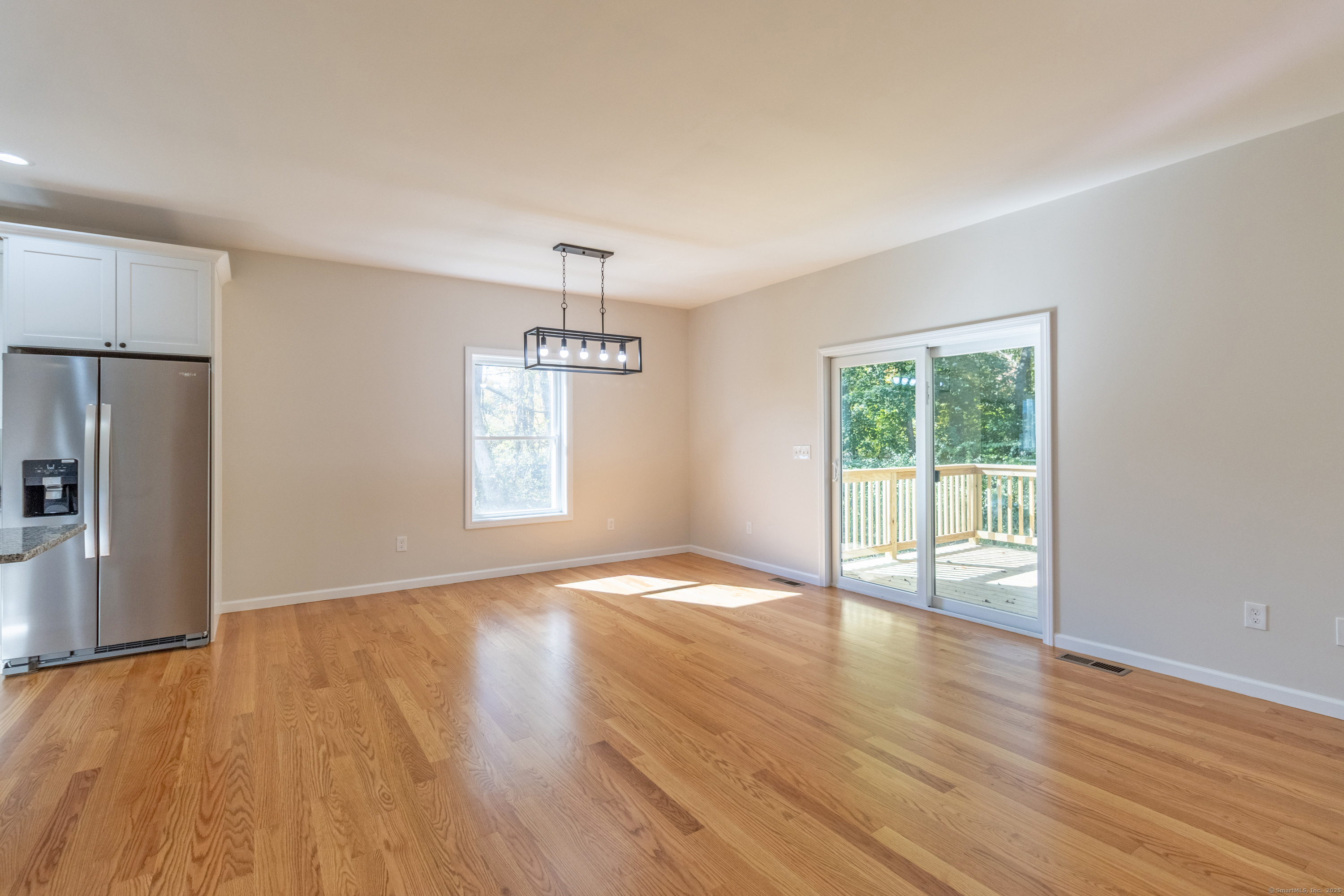 18 Spring Hill Road Storrs Mansfield, CT 06268 - Photo 14 of 31 a view of an empty room with a window and wooden floor