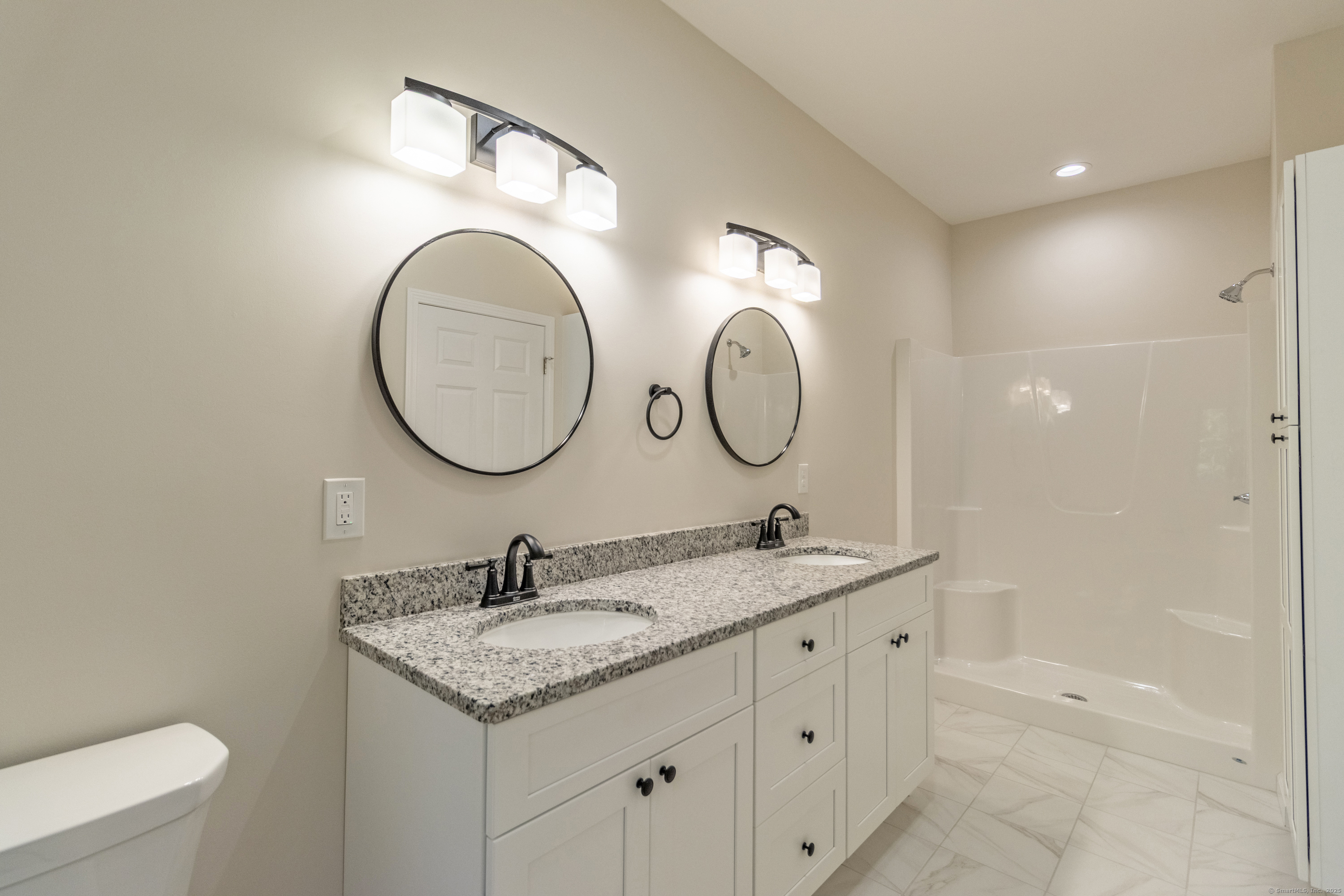 18 Spring Hill Road Storrs Mansfield, CT 06268 - Photo 15 of 31 a bathroom with a granite countertop double vanity sink and a mirror