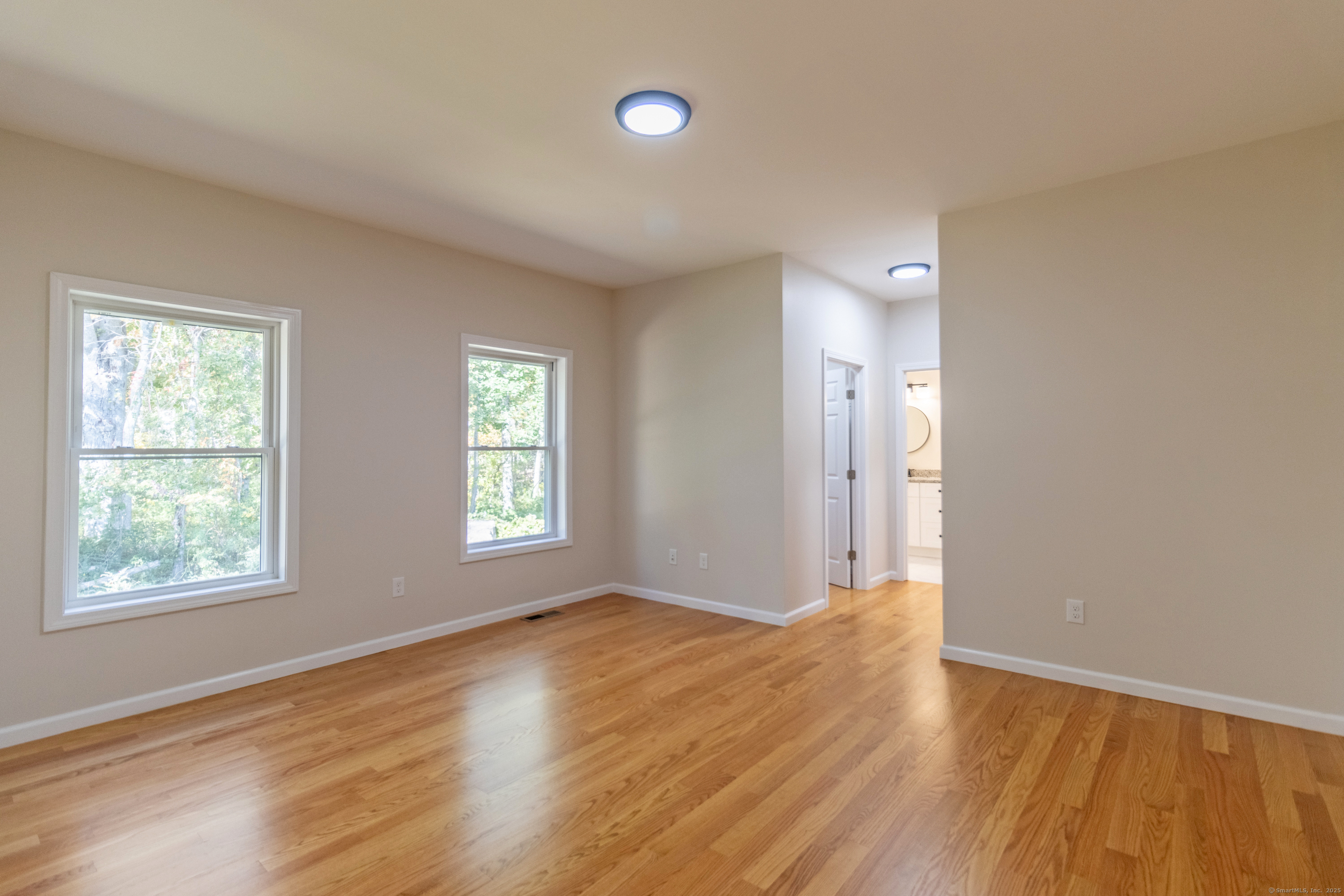 18 Spring Hill Road Storrs Mansfield, CT 06268 - Photo 22 of 31 a view of an empty room with wooden floor and window