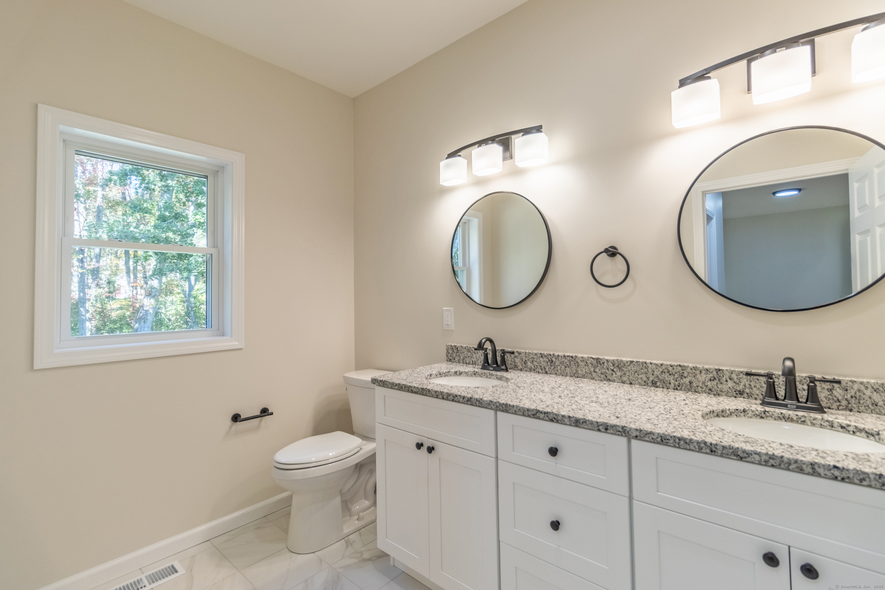 18 Spring Hill Road Storrs Mansfield, CT 06268 - Photo 26 of 31 a bathroom with 2 sink and a mirror