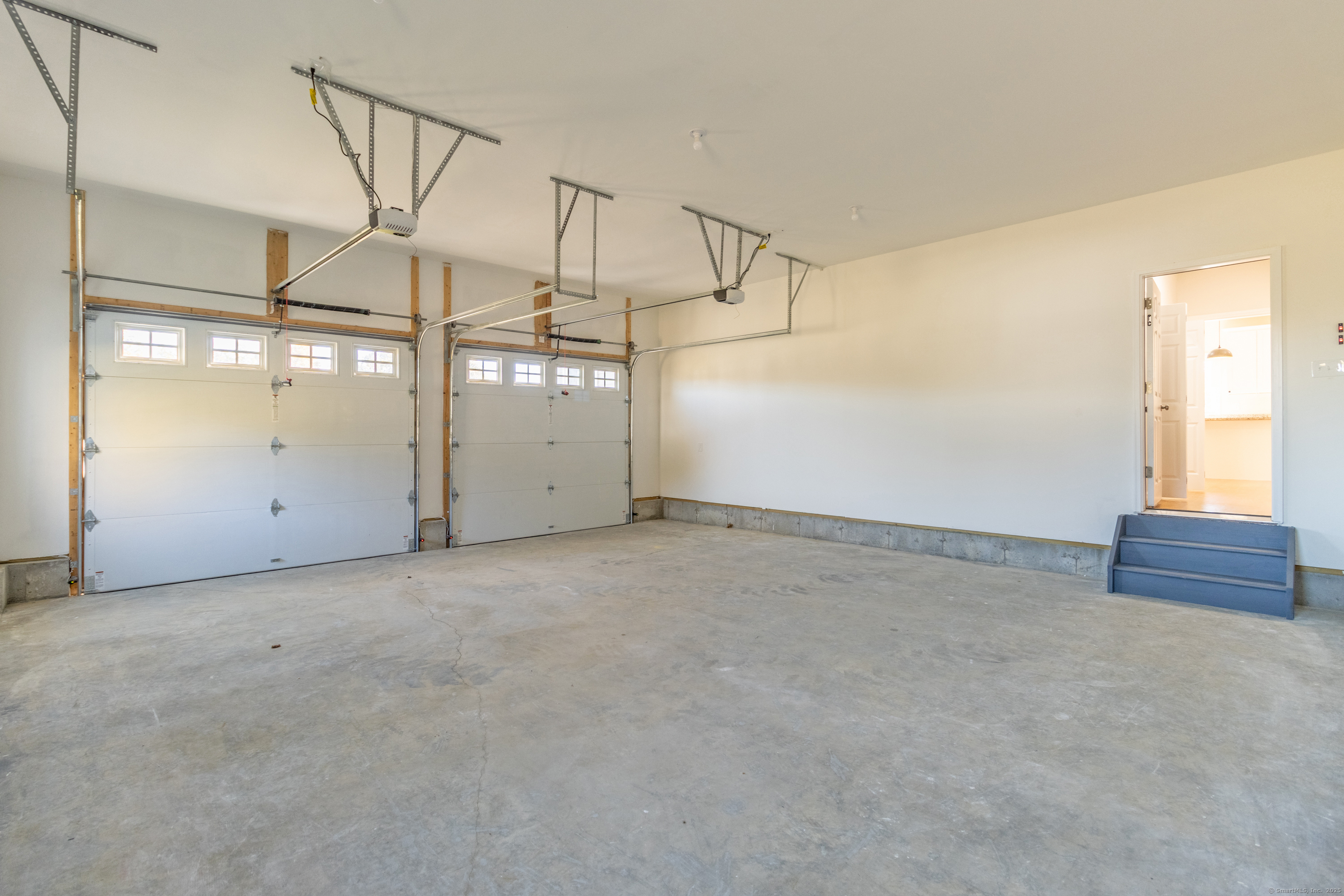 18 Spring Hill Road Storrs Mansfield, CT 06268 - Photo 28 of 31 an empty room with windows and pillars in it