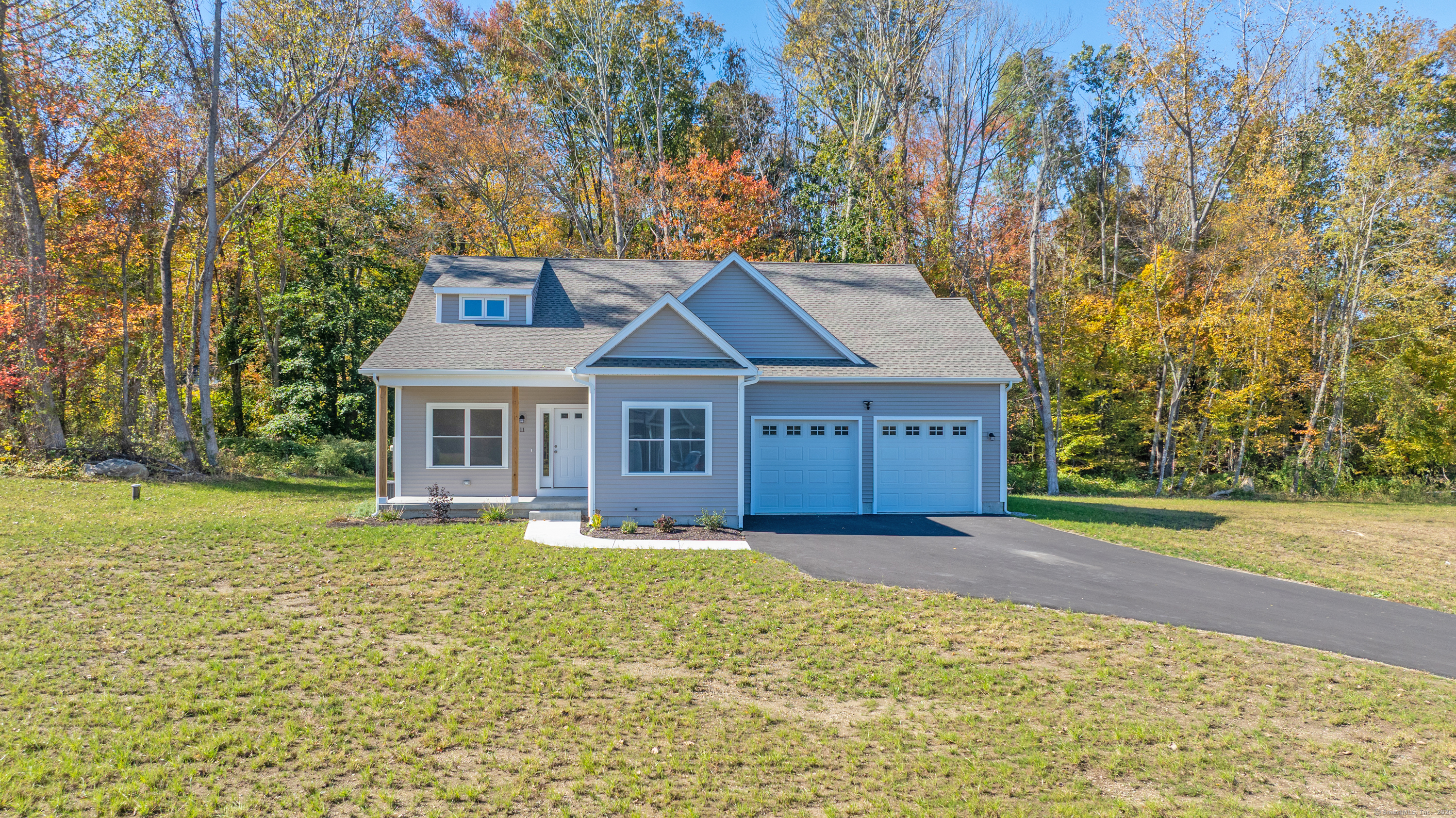 18 Spring Hill Road Storrs Mansfield, CT 06268 - Photo 30 of 31 a front view of a house with a yard