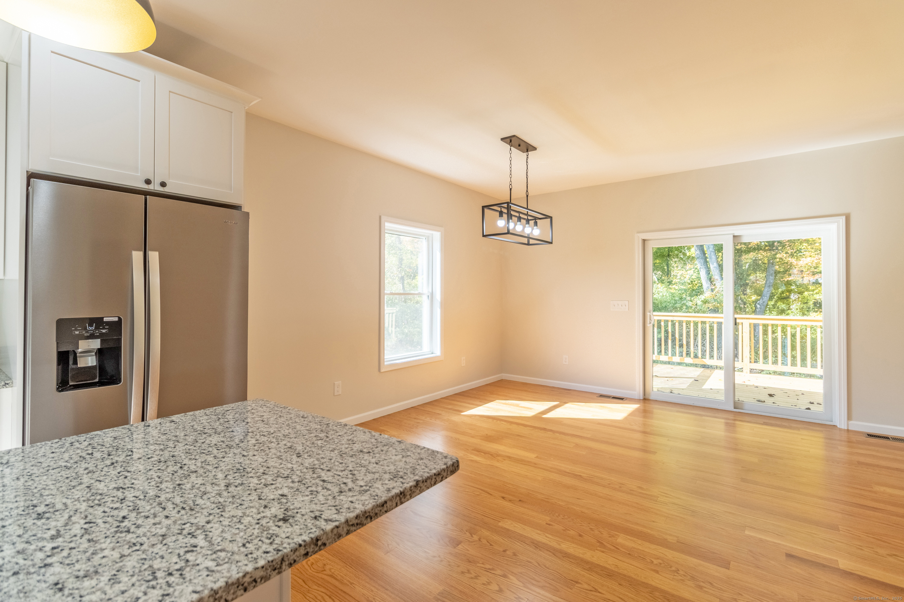 18 Spring Hill Road Storrs Mansfield, CT 06268 - Photo 9 of 31 a view of an empty room with window and wooden floor