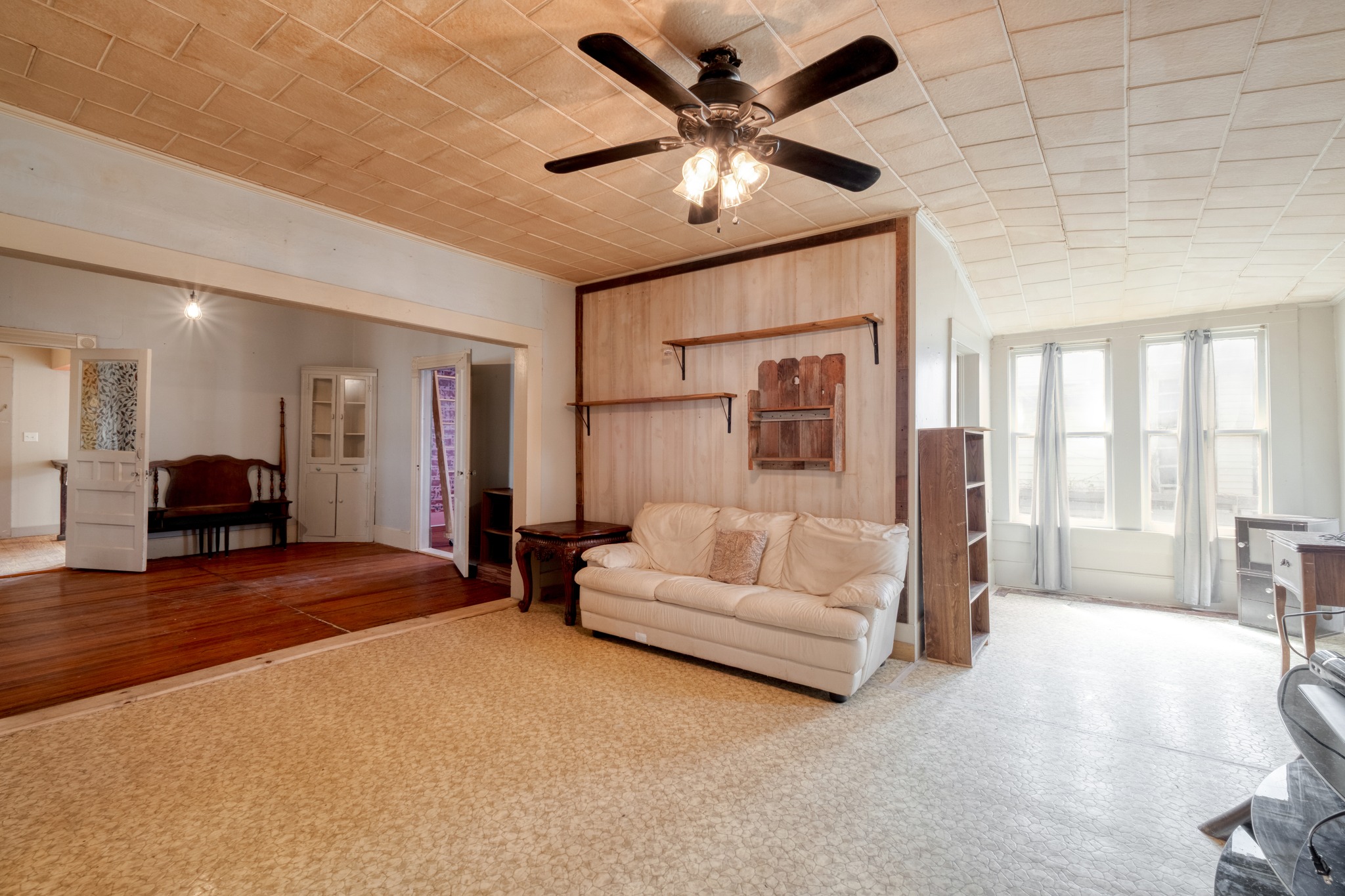 300 South Rio Grande Street Granger, TX 76530 - Photo 10 of 25 Carpeted living area featuring a ceiling fan