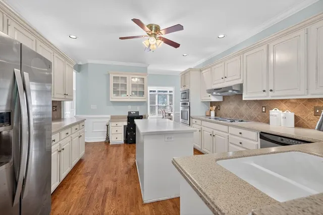 a kitchen with a stove and cabinets