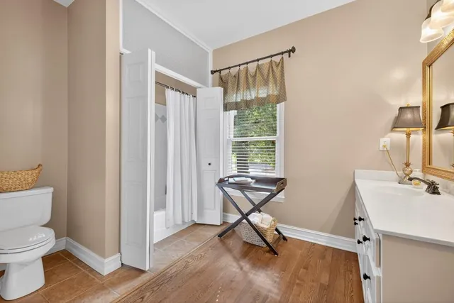 a bathroom with a sink double vanity and a mirror