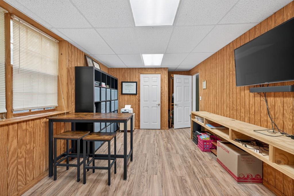 1430 Roanoke Trace Grayson, GA 30017 - Photo 38 of 62 a reading room with furniture wooden floor and a window