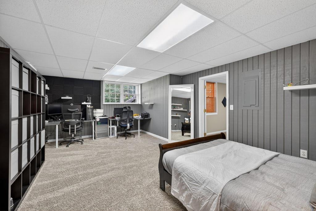 1430 Roanoke Trace Grayson, GA 30017 - Photo 42 of 62 a bedroom with furniture and a flat screen tv