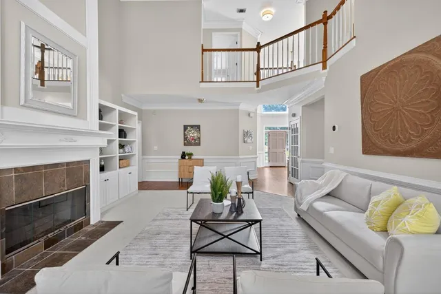 a dining room with furniture and wooden floor