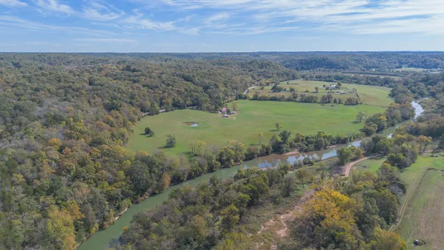a view of a field with an ocean