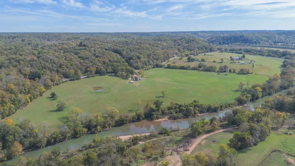 an aerial view of a houses with outdoor space