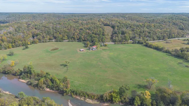 a view of a field with an ocean