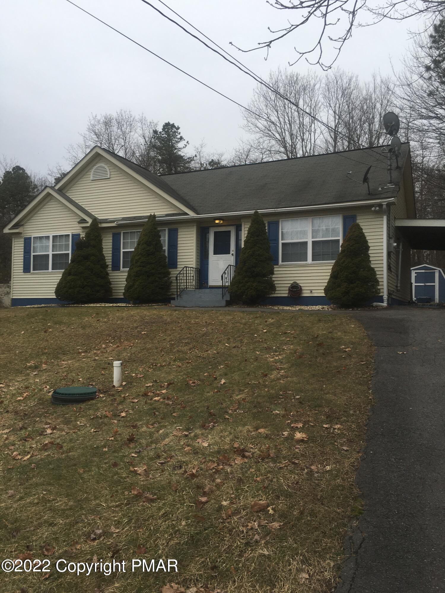 177 Granite Road Long Pond, PA 18334 - Photo 1 of 16 a front view of house with yard and trees in the background