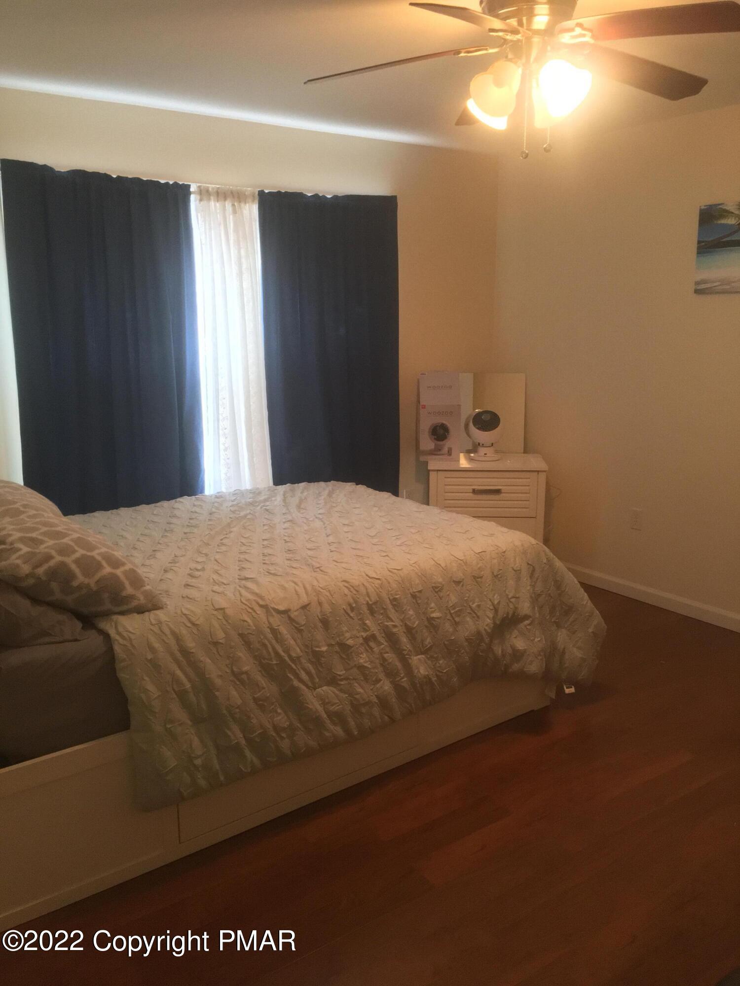 177 Granite Road Long Pond, PA 18334 - Photo 11 of 16 a bedroom with a bed and a window
