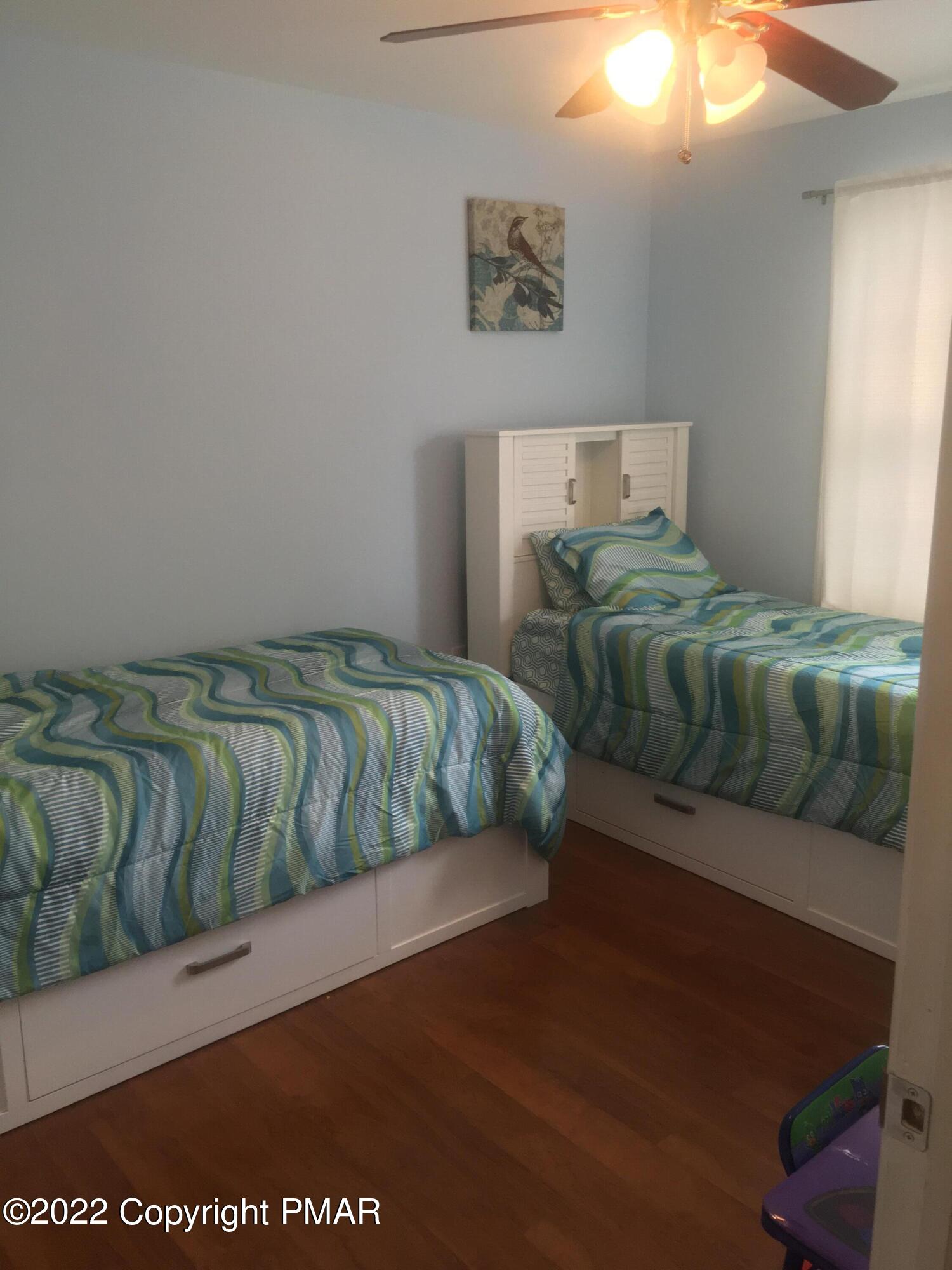177 Granite Road Long Pond, PA 18334 - Photo 12 of 16 a bedroom with a bed and window
