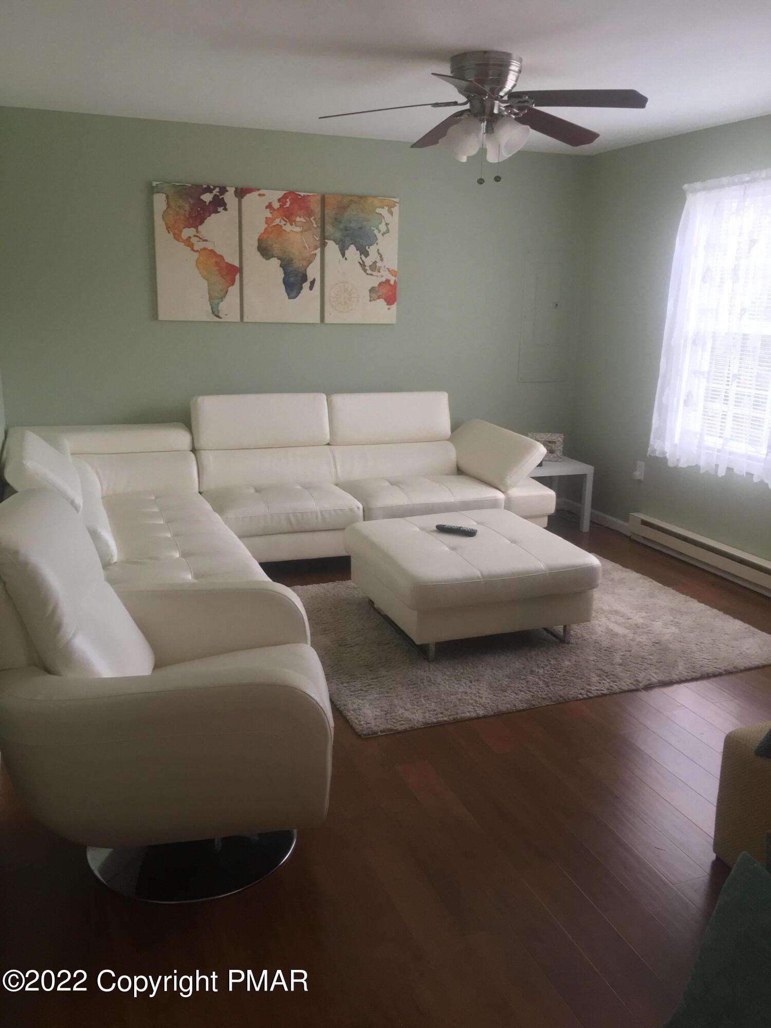 177 Granite Road Long Pond, PA 18334 - Photo 4 of 16 a living room with couches and a table with wooden floor