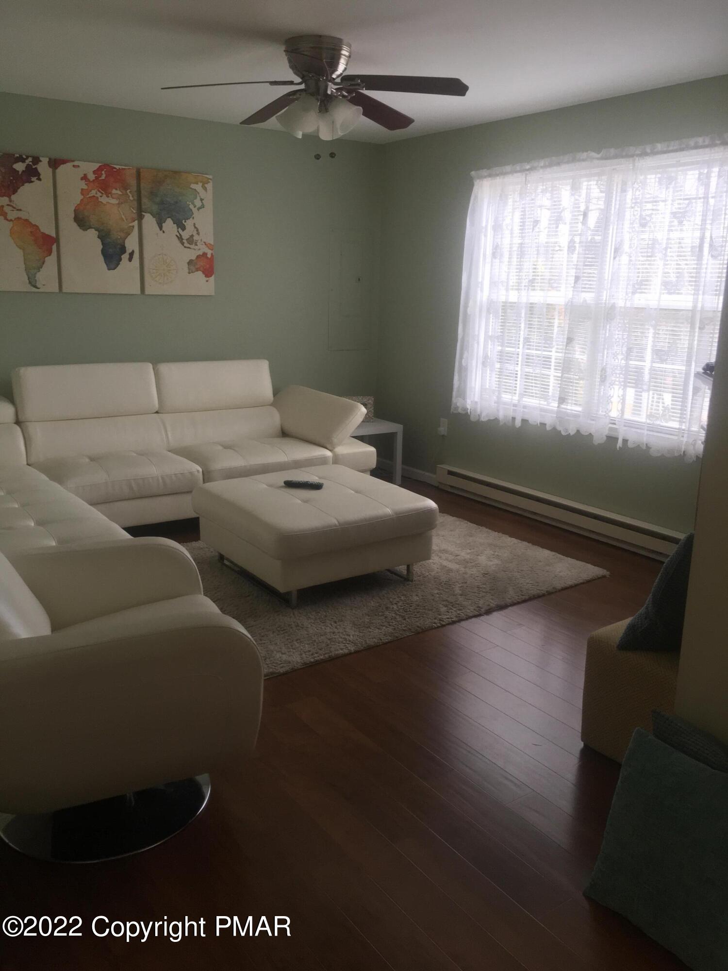 177 Granite Road Long Pond, PA 18334 - Photo 5 of 16 a living room with couches and a large window