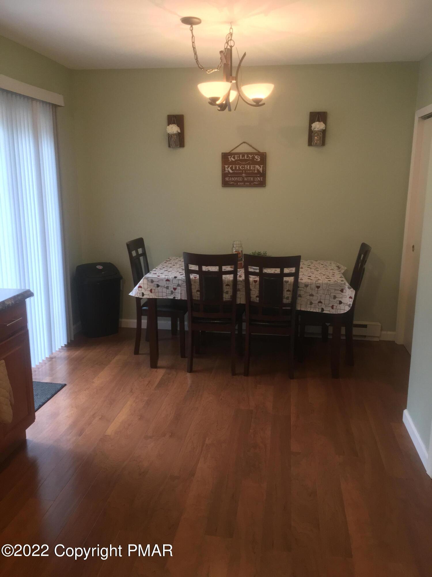 177 Granite Road Long Pond, PA 18334 - Photo 8 of 16 a dining room with furniture and chandelier