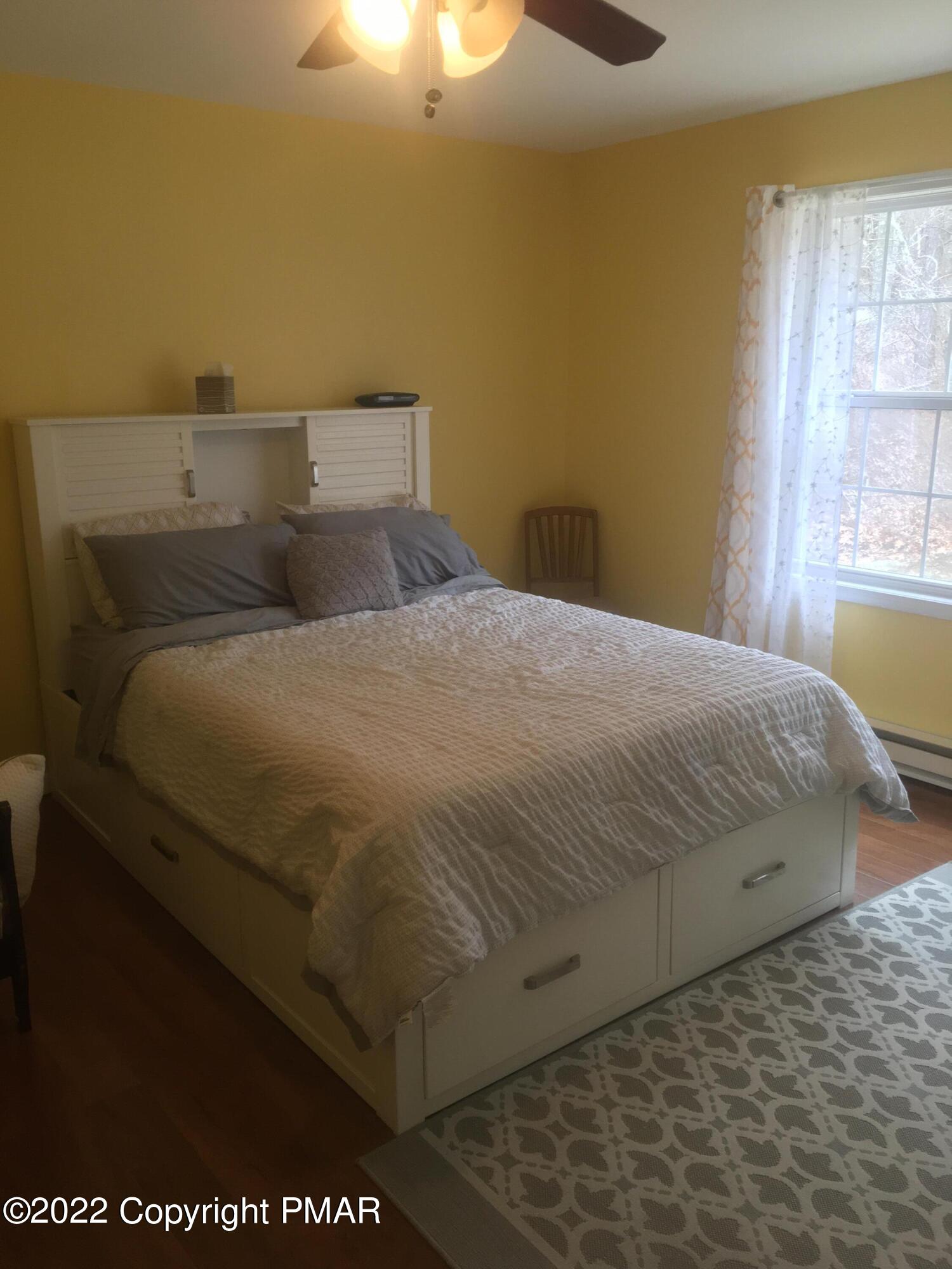 177 Granite Road Long Pond, PA 18334 - Photo 10 of 16 a bed sitting in a bedroom next to a window